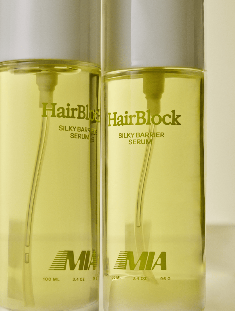 Two bottles of HairBlock Silky Barrier Serum on a white background